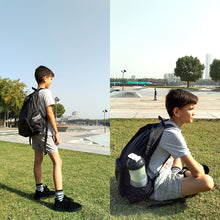 Load image into Gallery viewer, boy wearing black backpack
