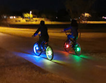 Load image into Gallery viewer, riding bike at night safely with cool wheel lights
