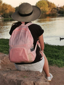 girl wearing pink backpack